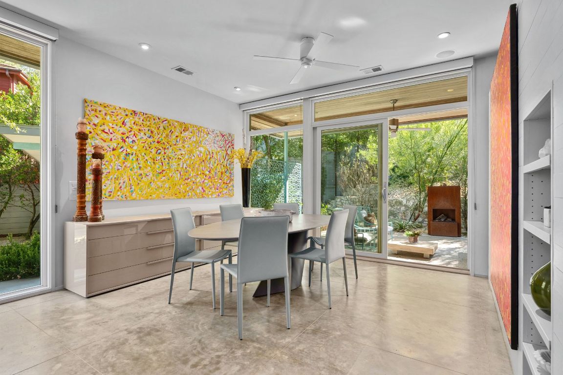 3705 Bridle Path Austin, TX 78703 - Photo 8 of 26 a dining room with furniture water view and balcony