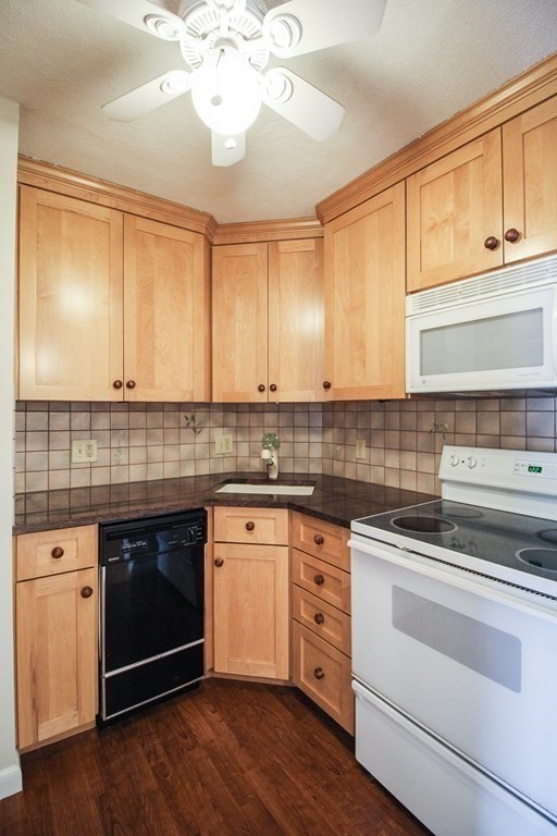 272 Albion Street, Unit 23 Wakefield, MA 01880 - Photo 15 of 33 a kitchen with a sink cabinets and wooden floor