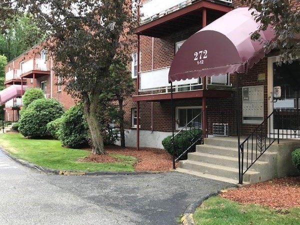 272 Albion Street, Unit 23 Wakefield, MA 01880 - Photo 3 of 33 a front view of a house with garden