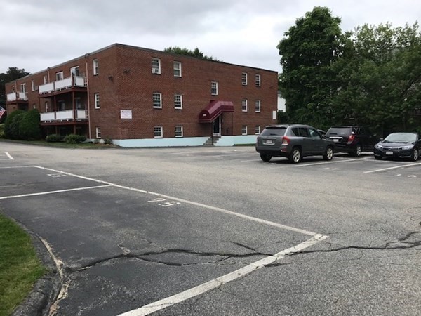 272 Albion Street, Unit 23 Wakefield, MA 01880 - Photo 31 of 33 a car parked in front of a building
