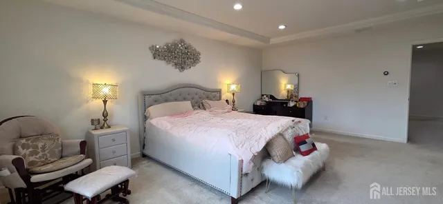 a bedroom with a bed and a lamp