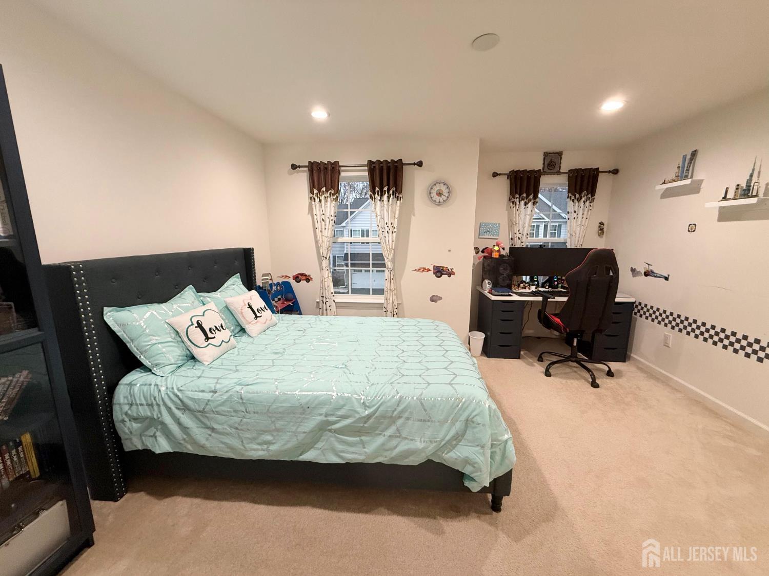 39 Periwinkle Drive, Unit 9 Monroe Township, NJ 08831 - Photo 18 of 26 a bedroom with a bed and furniture