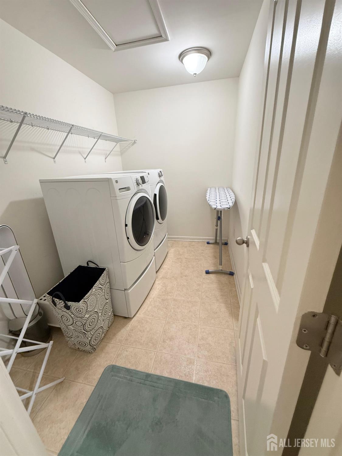 39 Periwinkle Drive, Unit 9 Monroe Township, NJ 08831 - Photo 20 of 26 a utility room with dryer and washer
