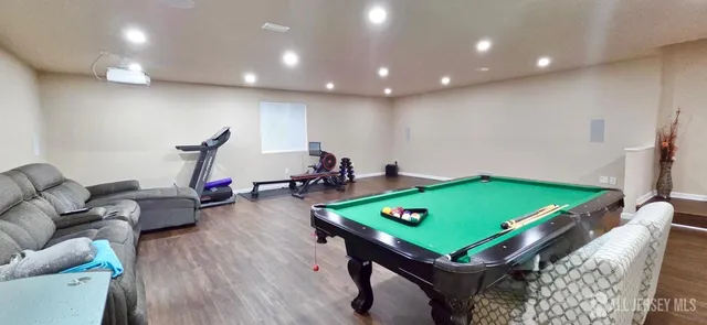a room with furniture pool table and table tennis