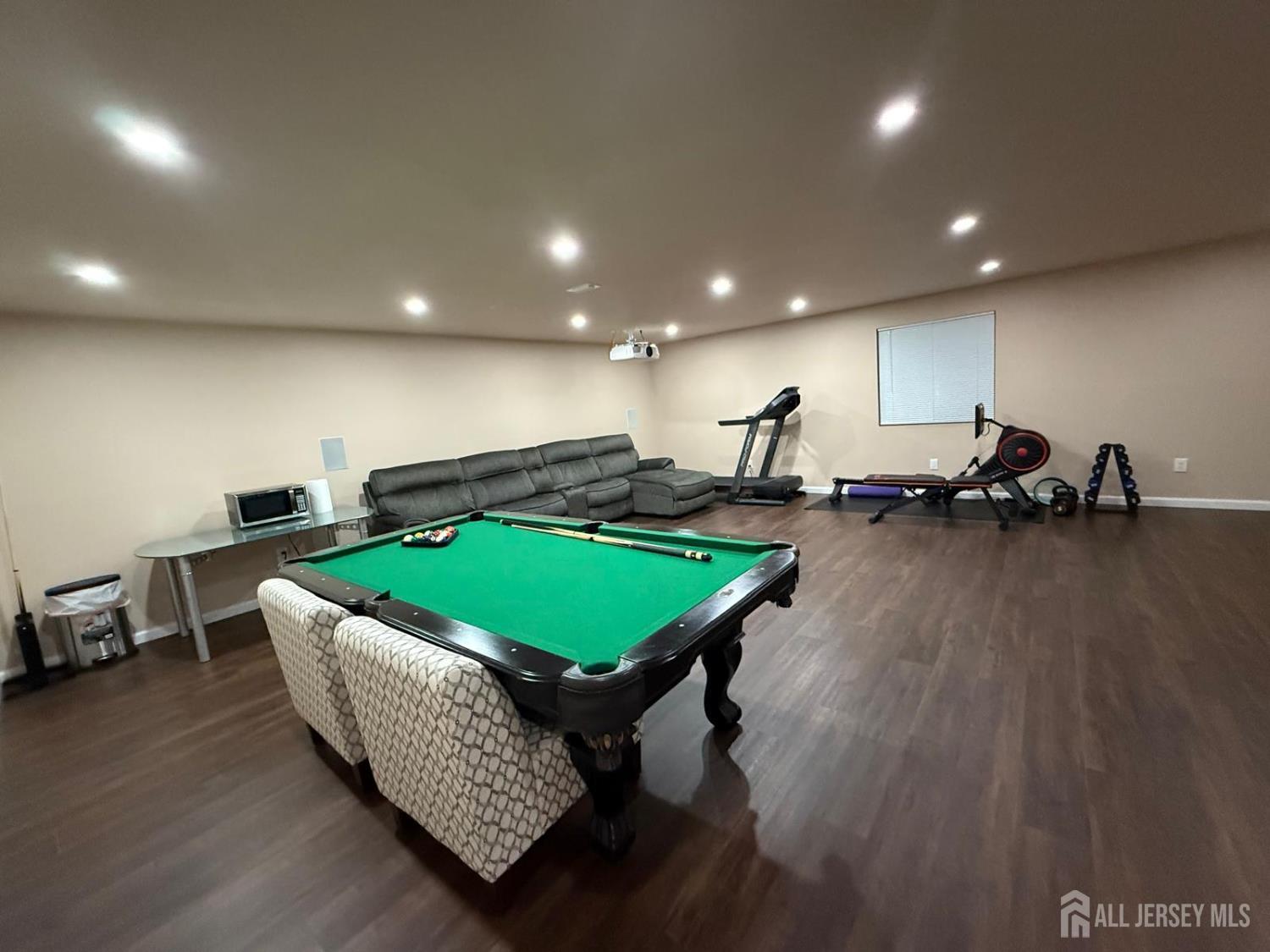 39 Periwinkle Drive, Unit 9 Monroe Township, NJ 08831 - Photo 23 of 26 a room with pool table and windows