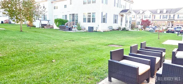 a view of a patio with a yard