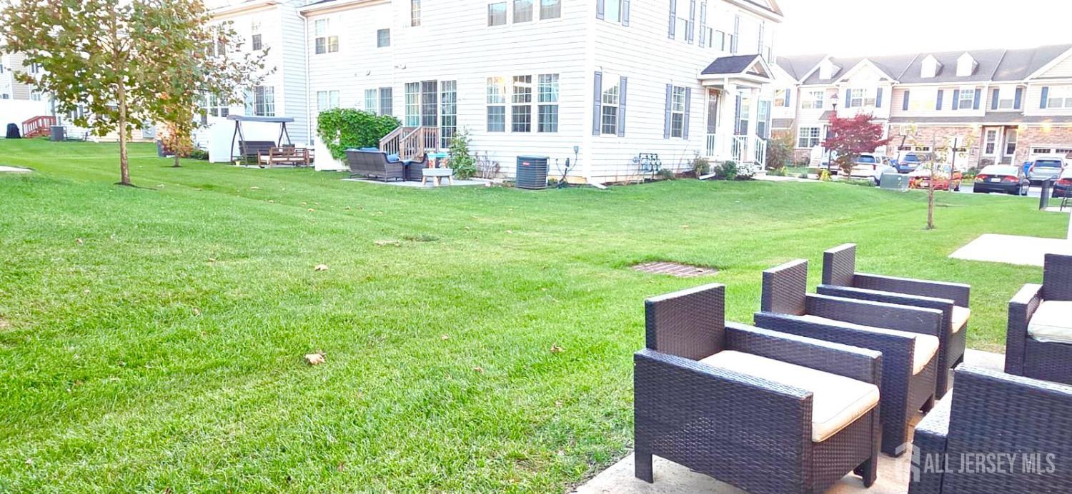 39 Periwinkle Drive, Unit 9 Monroe Township, NJ 08831 - Photo 25 of 26 a view of a patio with a yard