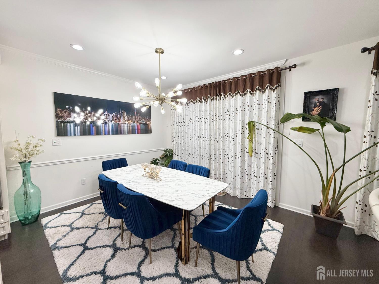 39 Periwinkle Drive, Unit 9 Monroe Township, NJ 08831 - Photo 6 of 26 a view of a dining room with furniture and wooden floor