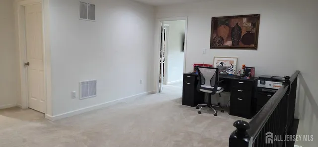 a view of a workspace with furniture