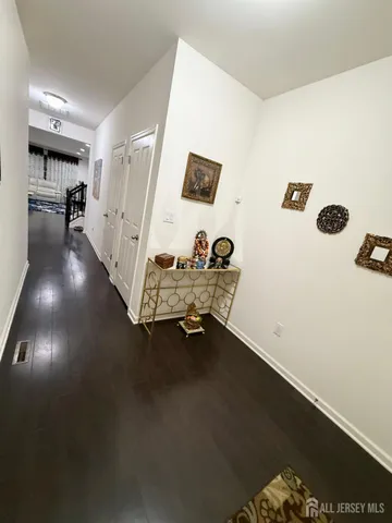 a room with gym equipment and view of living room