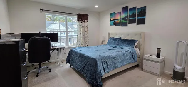 a bedroom with a bed chair and window