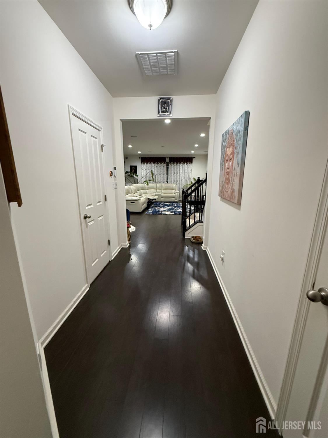 39 Periwinkle Drive, Unit 9 Monroe Township, NJ 08831 - Photo 10 of 26 workspace with wooden floor windows and a chandelier