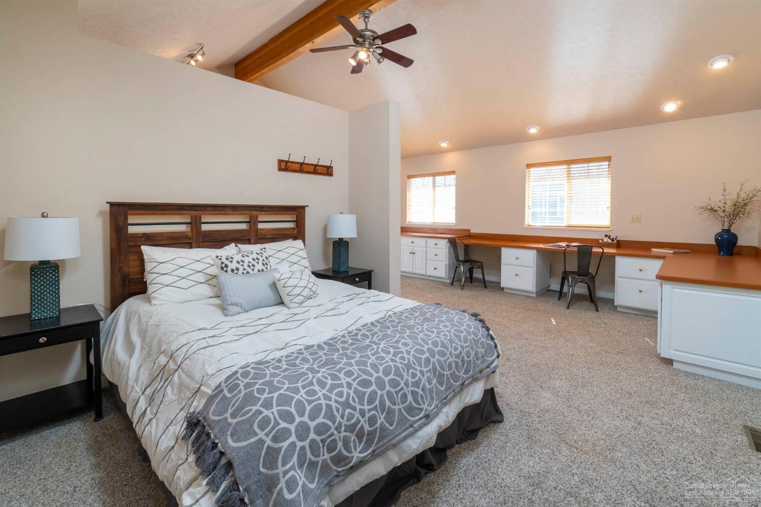 60098 Cinder Butte Road Bend, OR 97702 - Photo 13 of 25 a bed room with a bed and a table chair