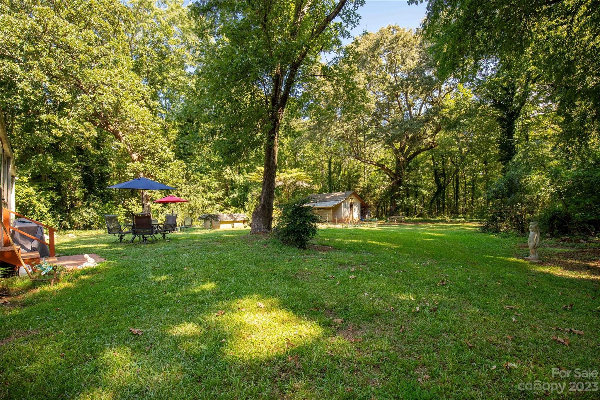 1364 Colony Road Lancaster, SC 29720 - Photo 28 of 38 a garden with trees in front of it