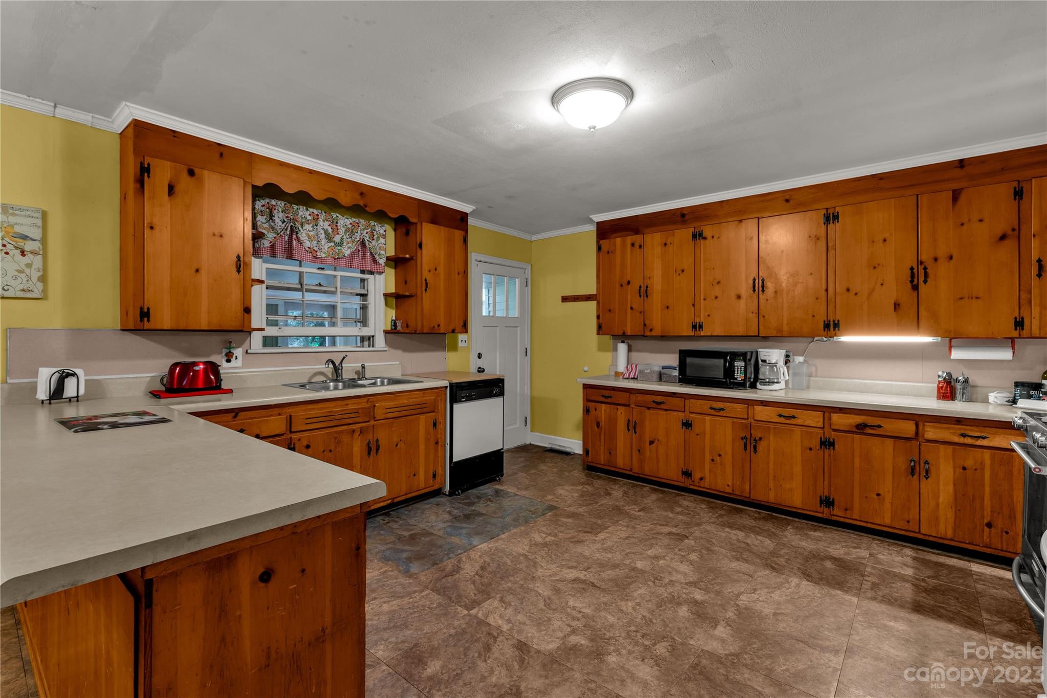 1364 Colony Road Lancaster, SC 29720 - Photo 6 of 38 a kitchen with stainless steel appliances sink cabinets and window