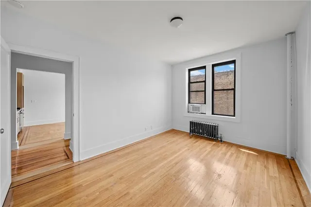 a view of an empty room and glass door