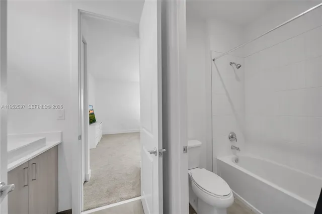 a bathroom with a bathtub toilet and sink