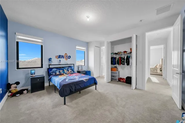 a living room with a bed and a couch