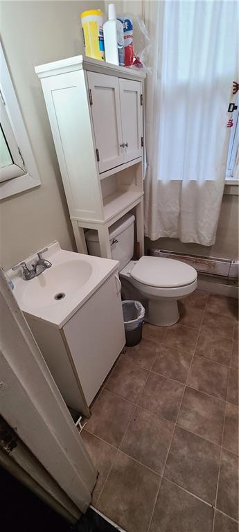 206 Brighton Road Pittsburgh, PA 15202 - Photo 14 of 20 a bathroom with a sink toilet and mirror