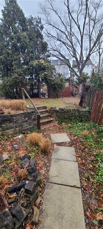 206 Brighton Road Pittsburgh, PA 15202 - Photo 16 of 20 a view of a yard with plants and trees