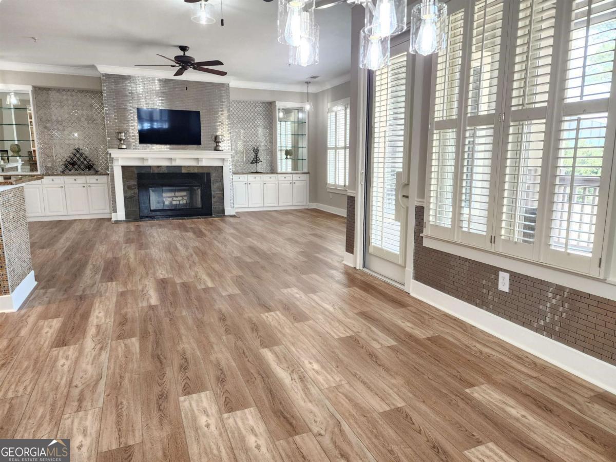 109 (unit 1203) South Bay Road Eatonton, GA 31024 - Photo 11 of 55 a living room with stainless steel appliances furniture and a fireplace