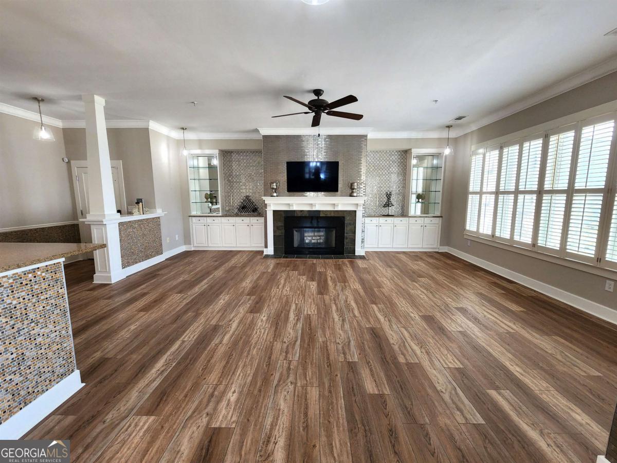 109 (unit 1203) South Bay Road Eatonton, GA 31024 - Photo 12 of 55 a living room with stainless steel appliances wooden floors and fireplace