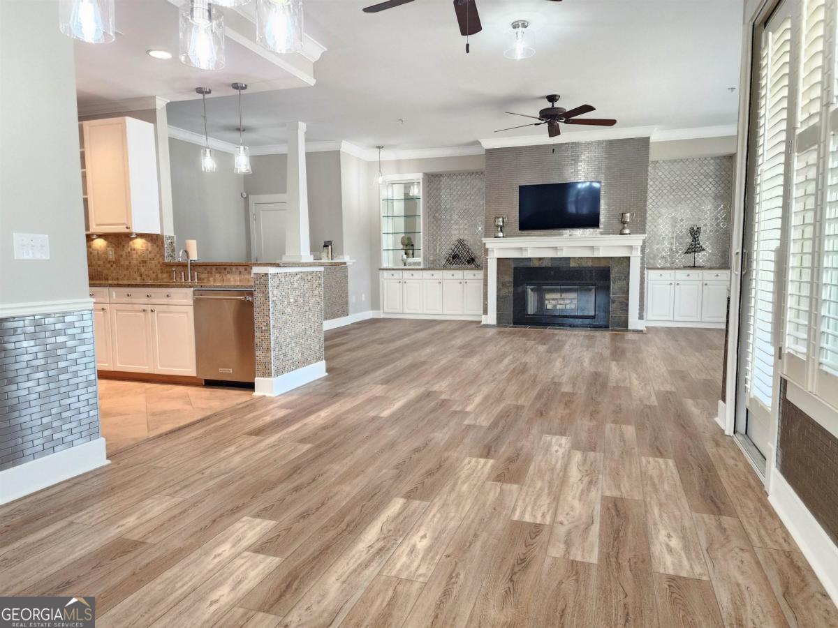 109 (unit 1203) South Bay Road Eatonton, GA 31024 - Photo 13 of 55 a large kitchen with cabinets wooden floor and stainless steel appliances