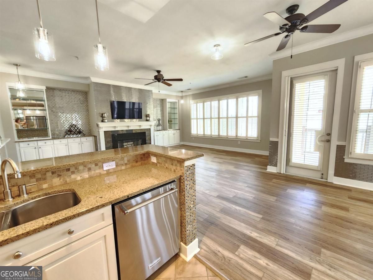 109 (unit 1203) South Bay Road Eatonton, GA 31024 - Photo 14 of 55 a kitchen with kitchen island a sink stove and wooden floor