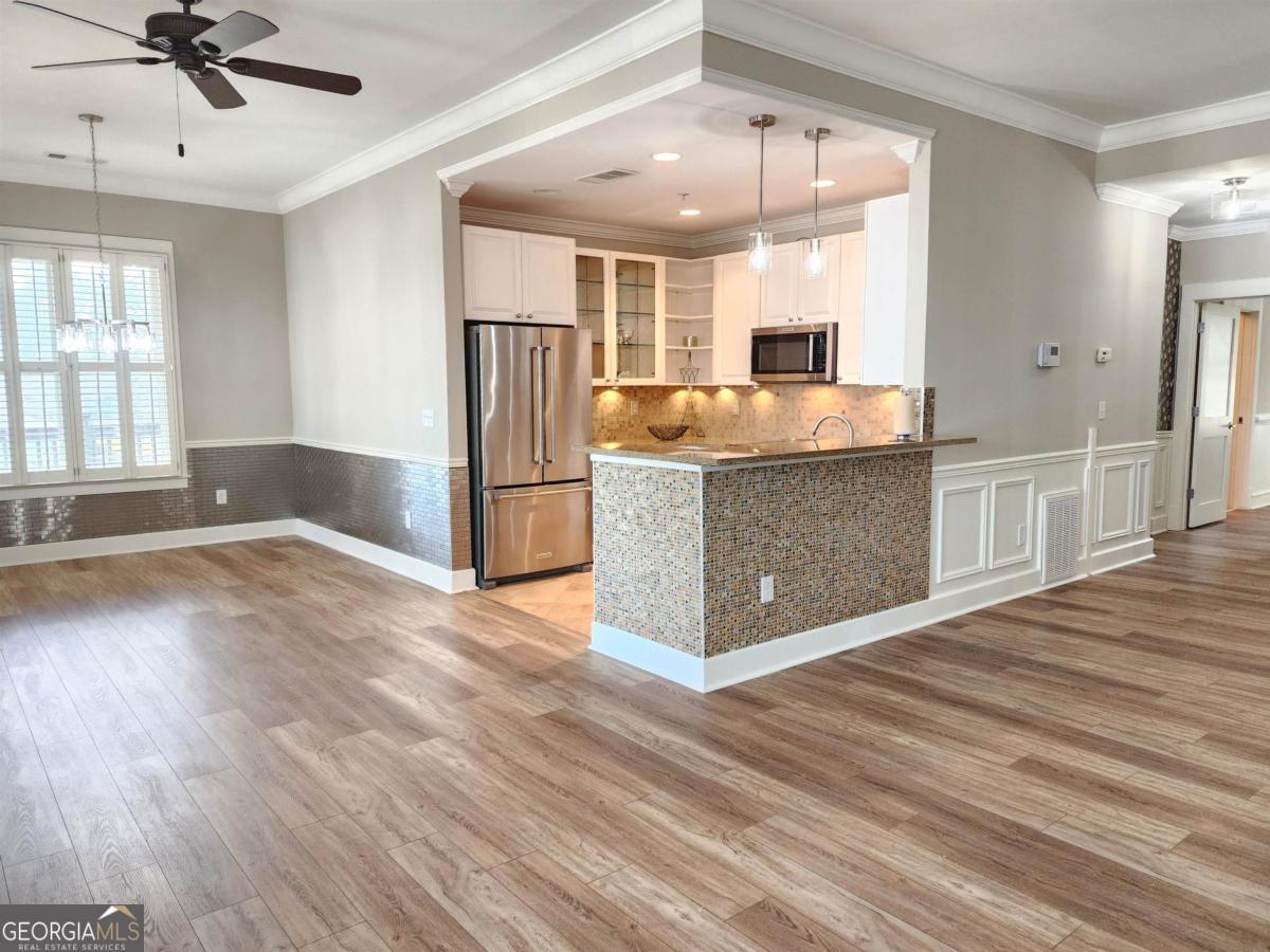 109 (unit 1203) South Bay Road Eatonton, GA 31024 - Photo 15 of 55 a view of kitchen with cabinets and wooden floor