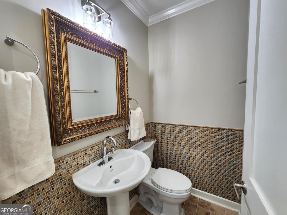 109 (unit 1203) South Bay Road Eatonton, GA 31024 - Photo 19 of 55 a bathroom with a toilet sink and mirror