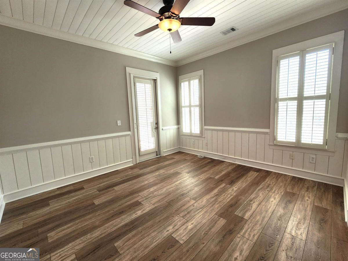 109 (unit 1203) South Bay Road Eatonton, GA 31024 - Photo 23 of 55 a view of an empty room with wooden floor and a window