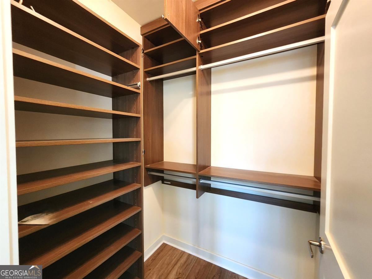 109 (unit 1203) South Bay Road Eatonton, GA 31024 - Photo 25 of 55 a view of walk in closet with empty racks