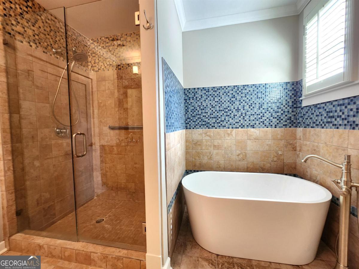 109 (unit 1203) South Bay Road Eatonton, GA 31024 - Photo 27 of 55 a bathroom with a bathtub and shower