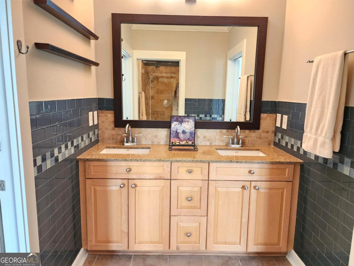 109 (unit 1203) South Bay Road Eatonton, GA 31024 - Photo 31 of 55 a bathroom with a double vanity sink and a mirror