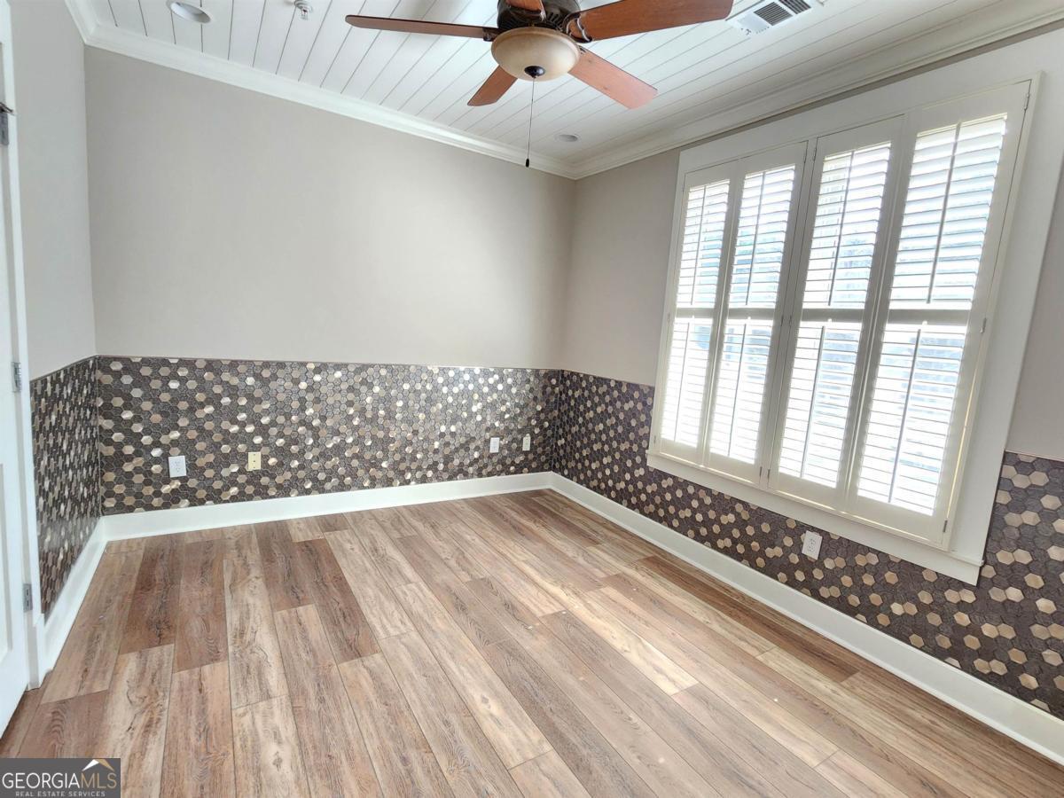 109 (unit 1203) South Bay Road Eatonton, GA 31024 - Photo 33 of 55 a view of an empty room and wooden floor