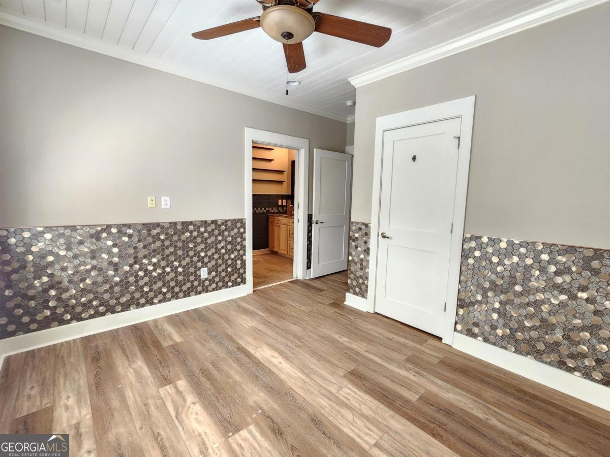 109 (unit 1203) South Bay Road Eatonton, GA 31024 - Photo 34 of 55 a view of an empty room and window wooden floor