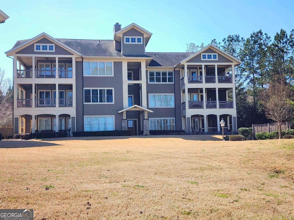 109 (unit 1203) South Bay Road Eatonton, GA 31024 - Photo 41 of 55 a front view of a building with a yard