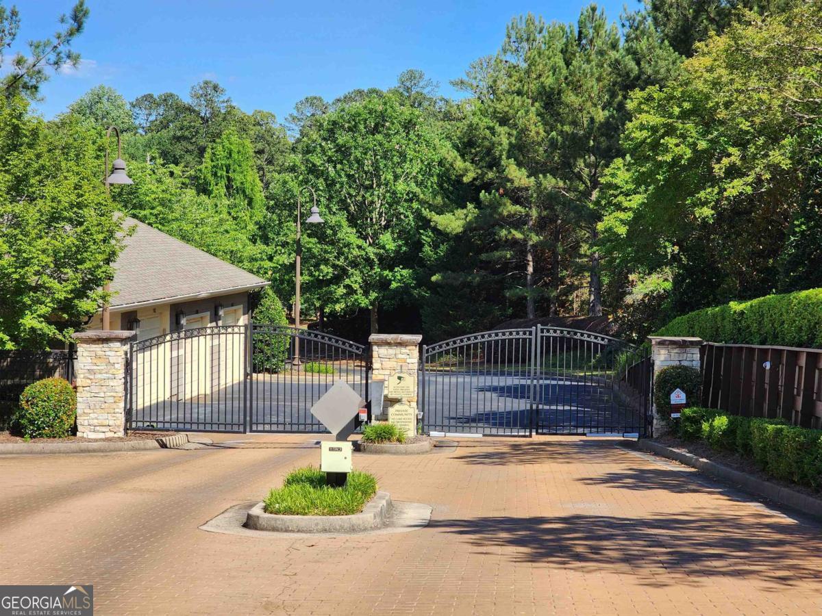109 (unit 1203) South Bay Road Eatonton, GA 31024 - Photo 48 of 55 a front view of a house with a yard and garage