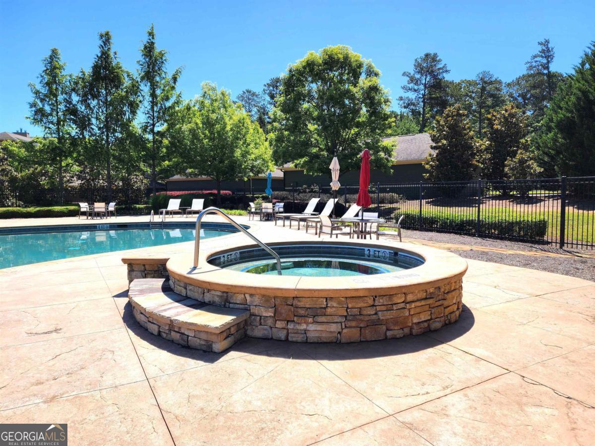 109 (unit 1203) South Bay Road Eatonton, GA 31024 - Photo 50 of 55 a view of a house with swimming pool and sitting area
