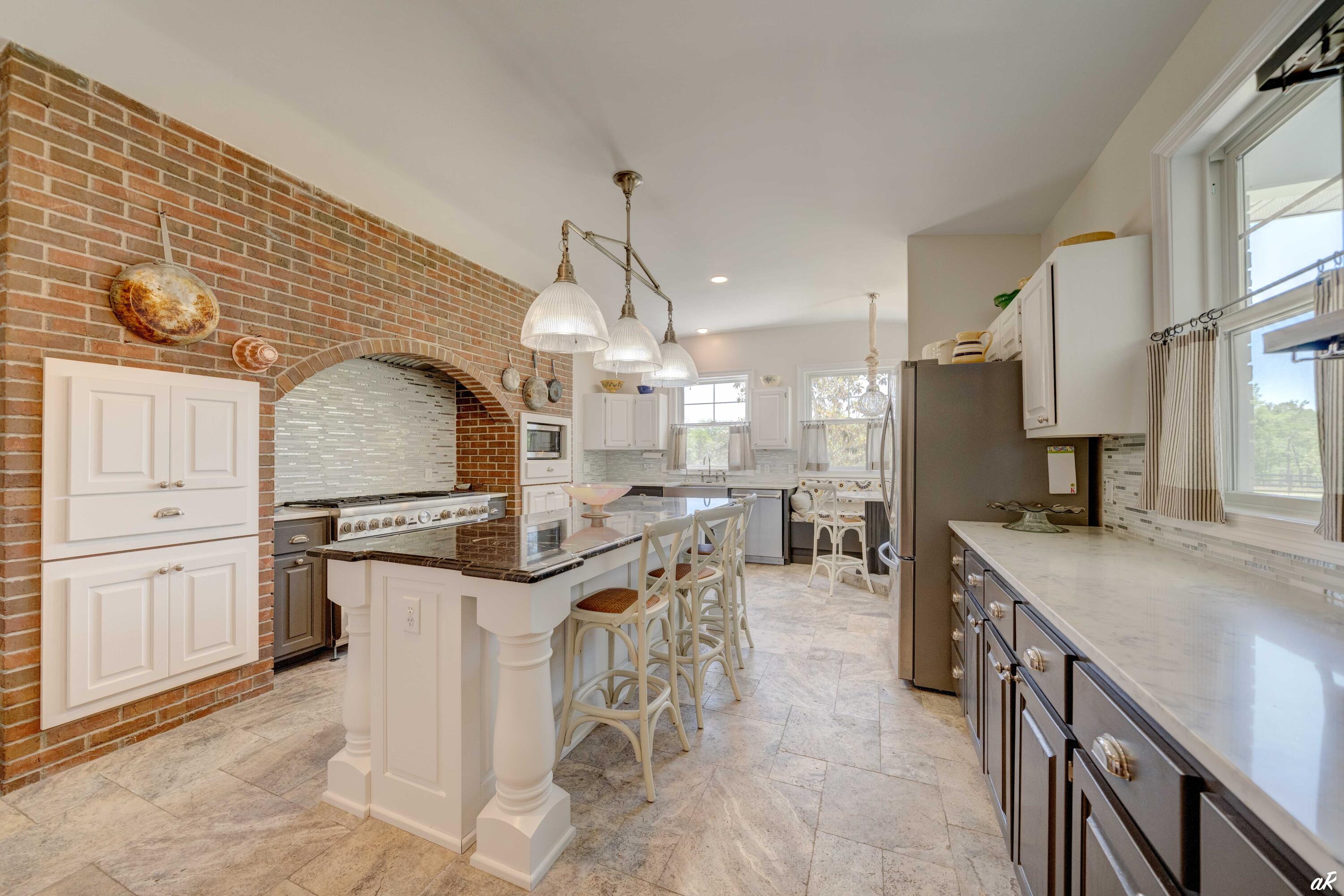 2513 Highway 79 Vernon, FL 32462 - Photo 18 of 85 a kitchen with stainless steel appliances granite countertop a stove and a refrigerator