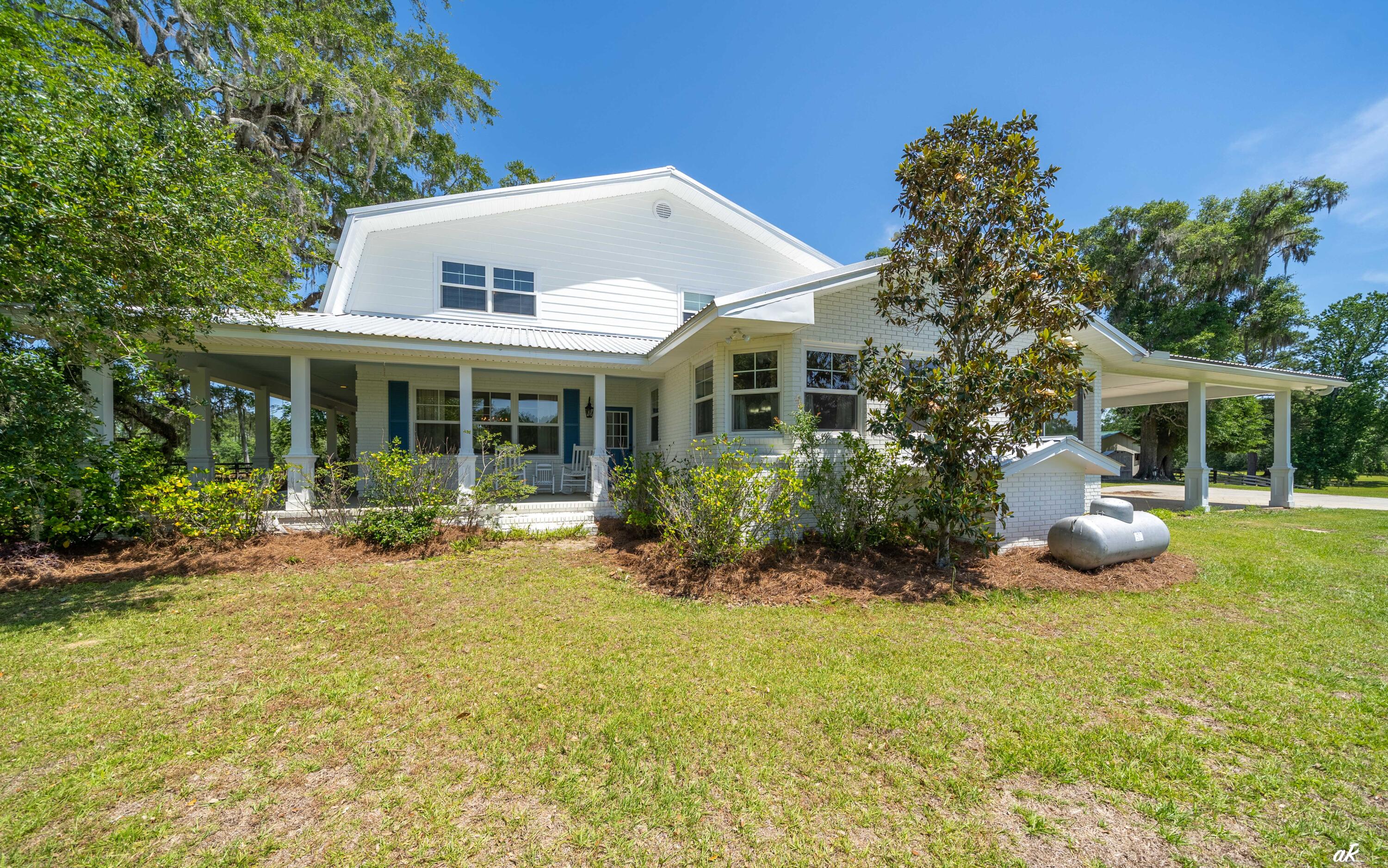 2513 Highway 79 Vernon, FL 32462 - Photo 51 of 85 a front view of a house with swimming pool and porch with furniture