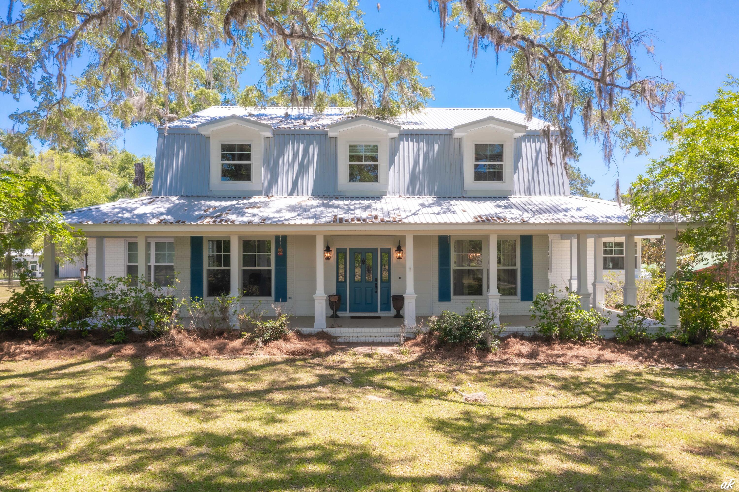 2513 Highway 79 Vernon, FL 32462 - Photo 52 of 85 a front view of a house with a porch