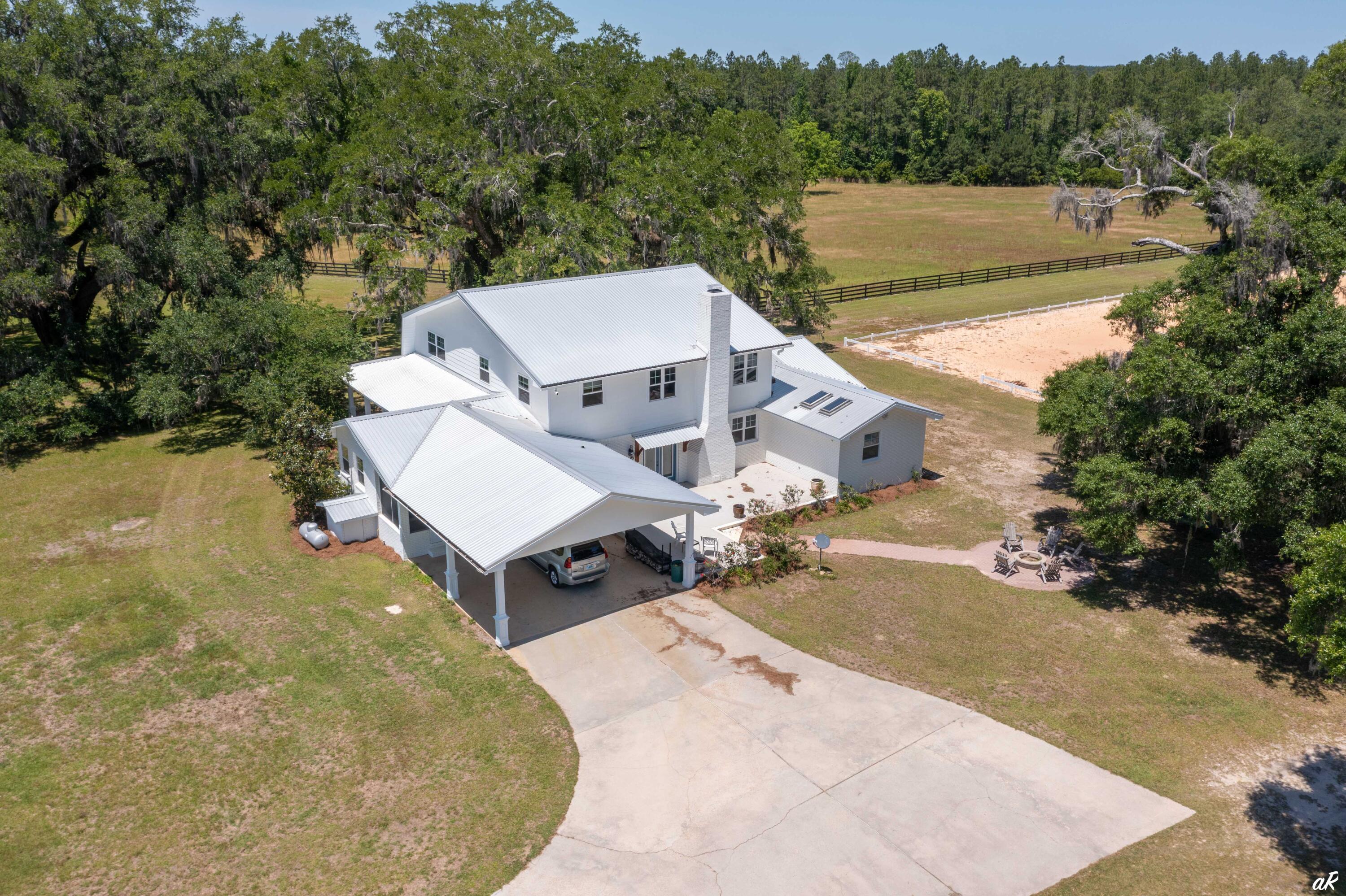 2513 Highway 79 Vernon, FL 32462 - Photo 54 of 85 an aerial view of a house with pool fire pit and outdoor seating