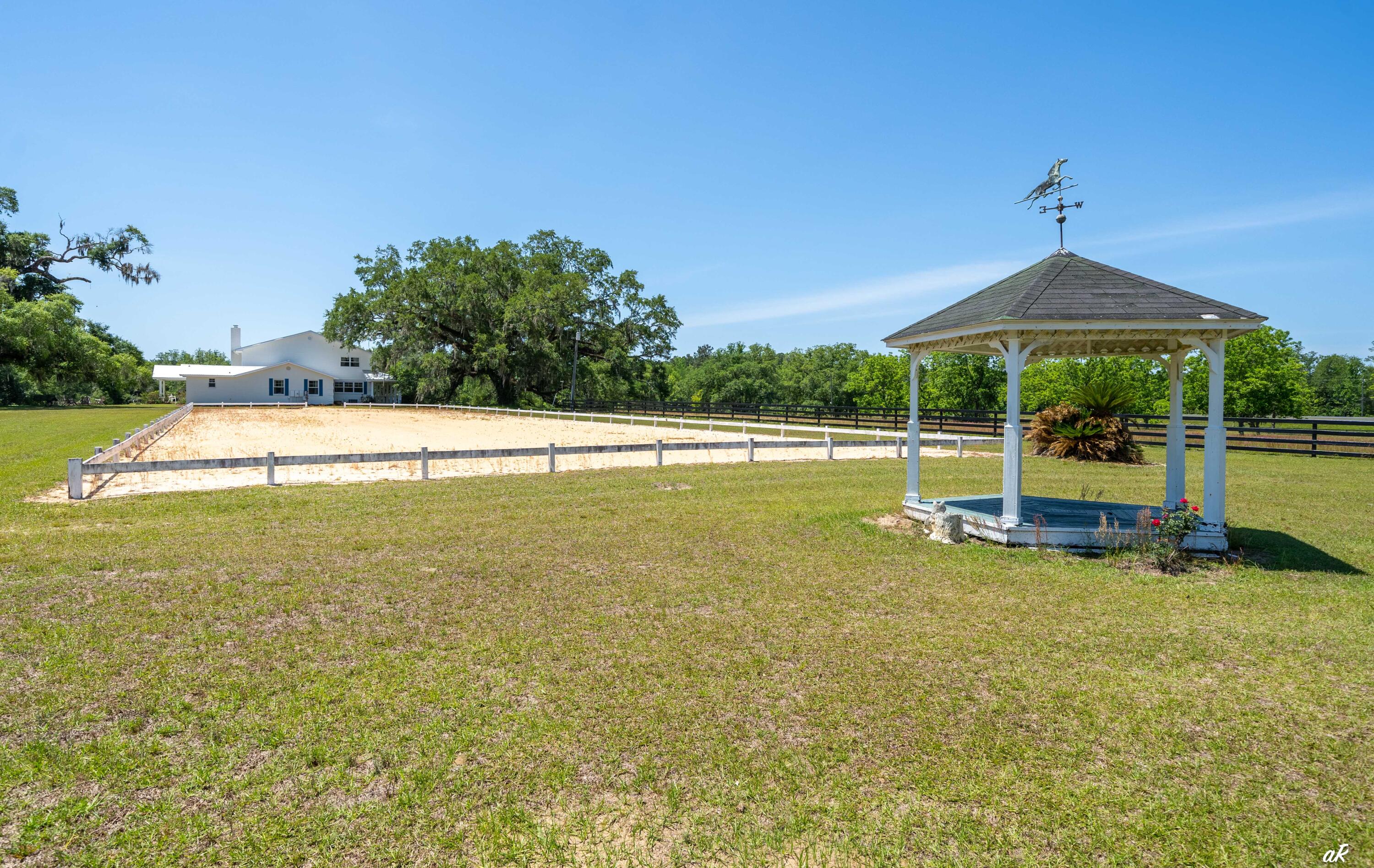 2513 Highway 79 Vernon, FL 32462 - Photo 77 of 85 a view of a swimming pool with an outdoor seating and deck