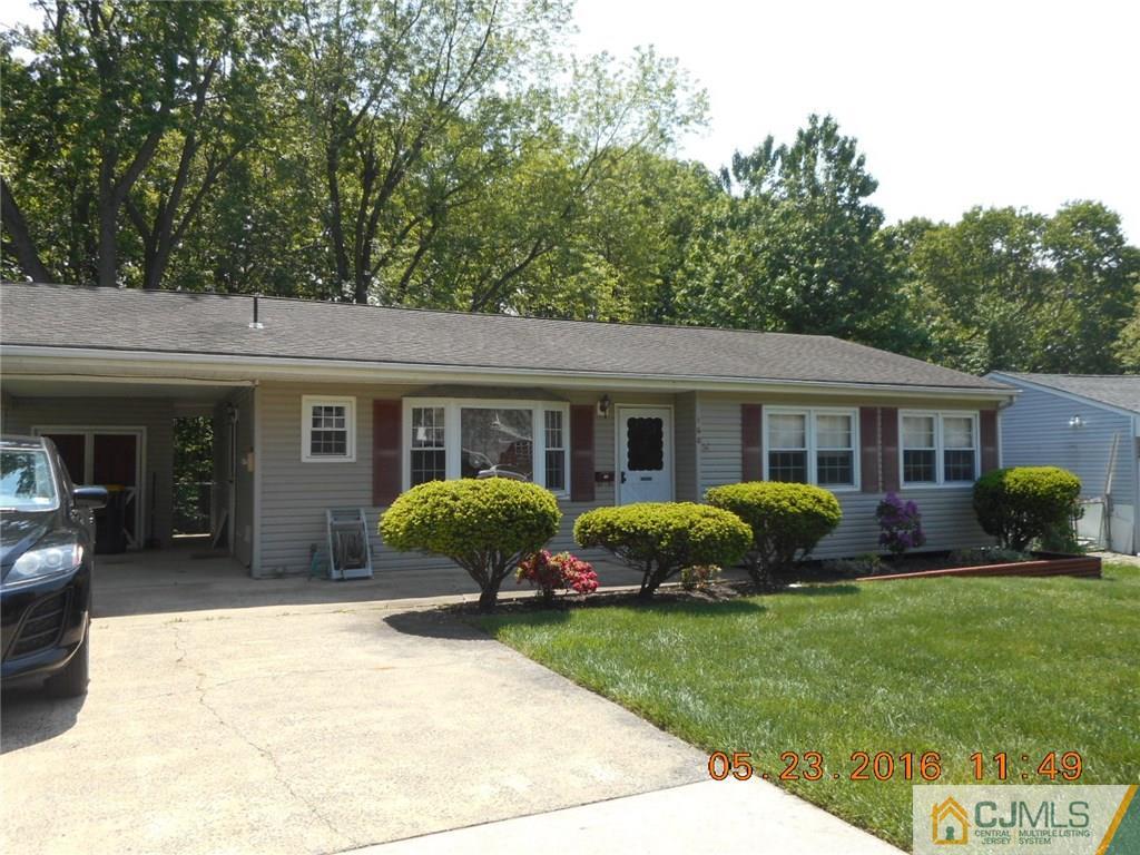 160 Princeton Road Old Bridge, NJ 08859 - Photo 1 of 21 a front view of a house with a garden and porch