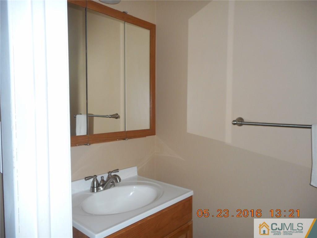 160 Princeton Road Old Bridge, NJ 08859 - Photo 14 of 21 a bathroom with a sink and a mirror