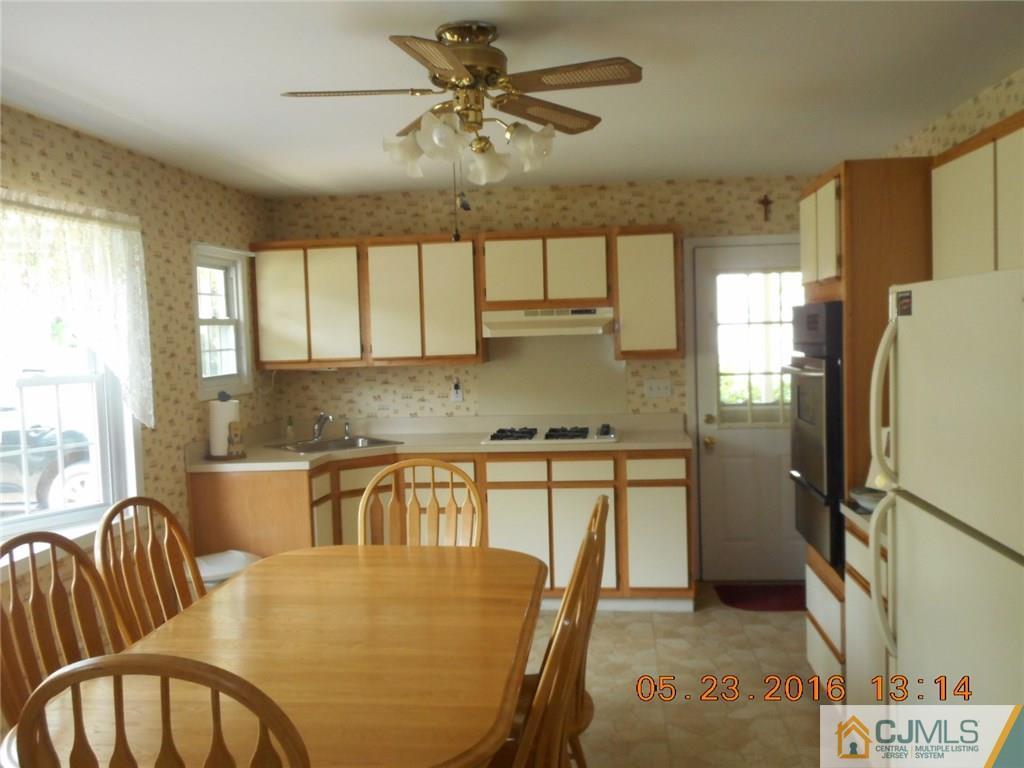 160 Princeton Road Old Bridge, NJ 08859 - Photo 4 of 21 a kitchen with stainless steel appliances granite countertop a refrigerator a sink a stove and island