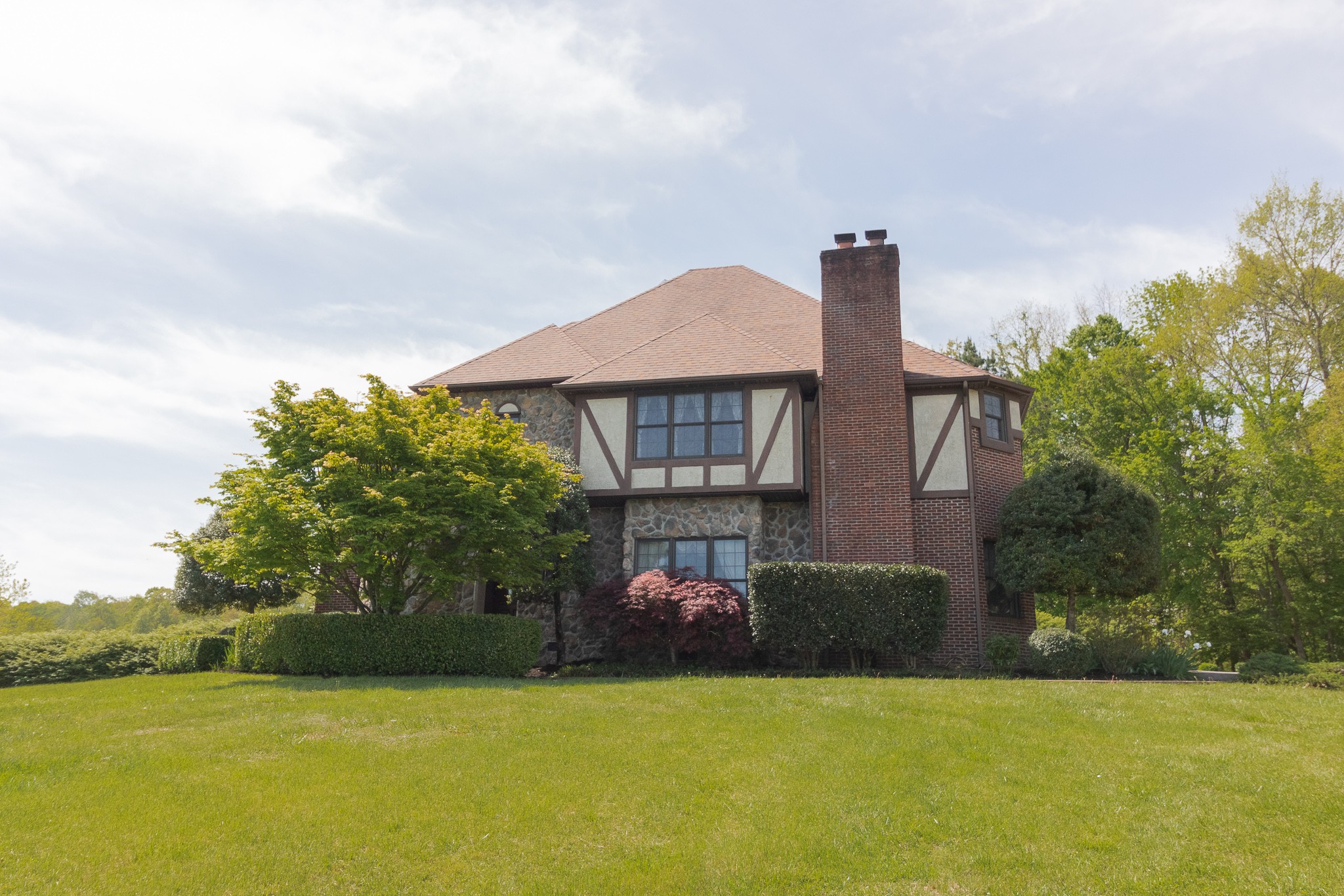 2654 Henry Gower Road Pleasant View, TN 37146 - Photo 2 of 49 a front view of a house with garden