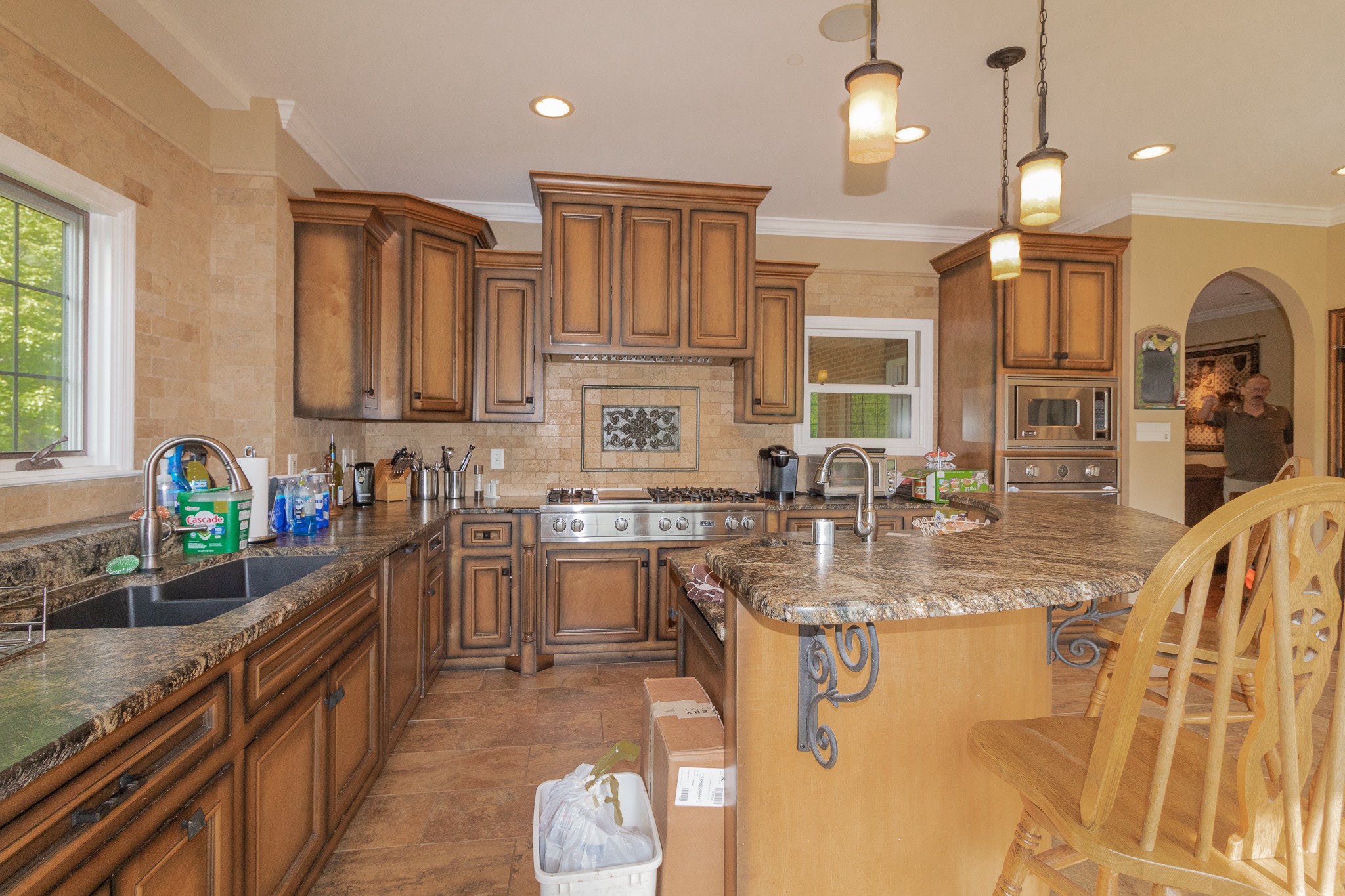 2654 Henry Gower Road Pleasant View, TN 37146 - Photo 19 of 49 a kitchen with stainless steel appliances granite countertop a sink a stove and a wooden cabinets