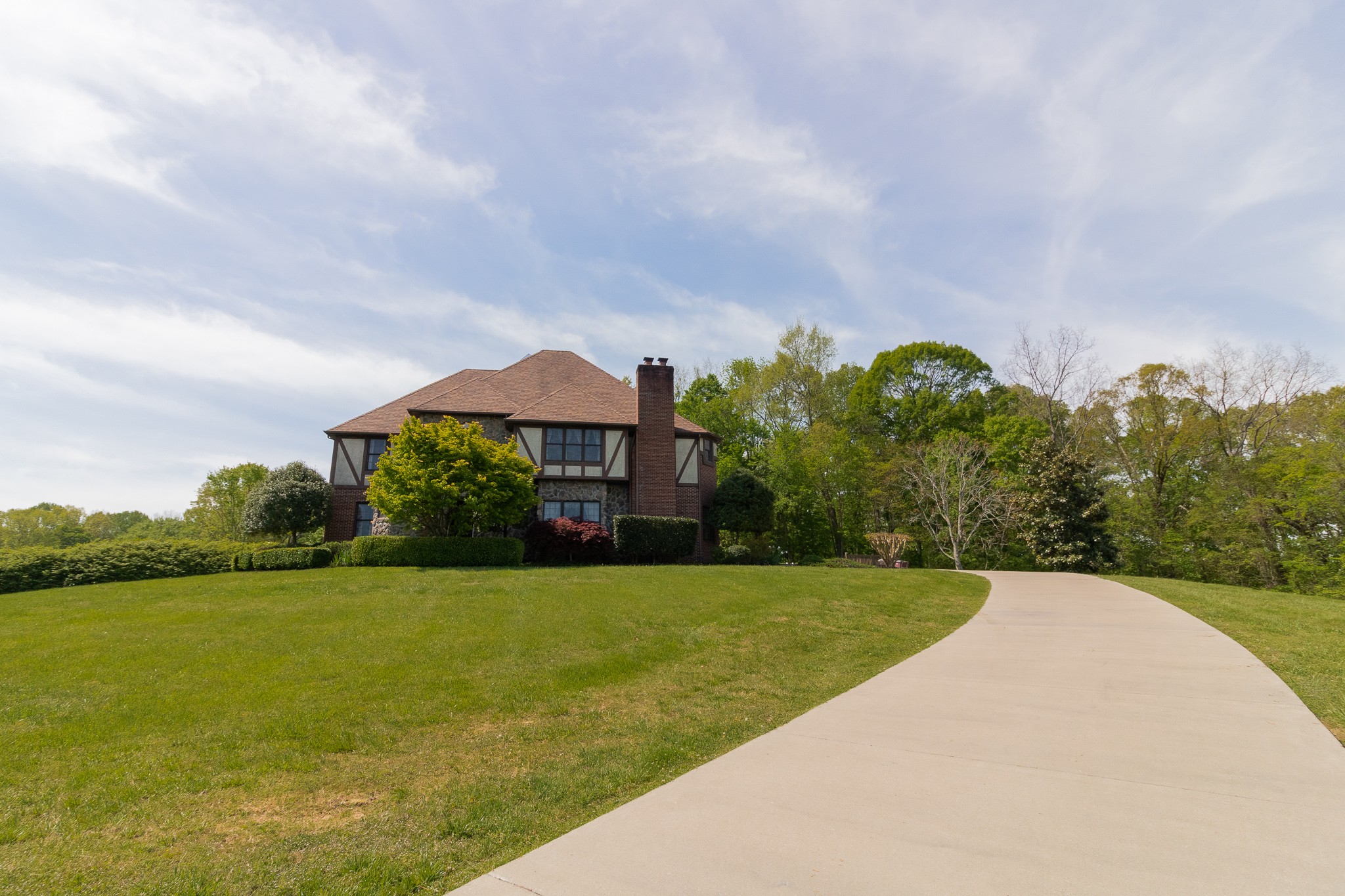 2654 Henry Gower Road Pleasant View, TN 37146 - Photo 3 of 49 a view of a garden with a building in the background